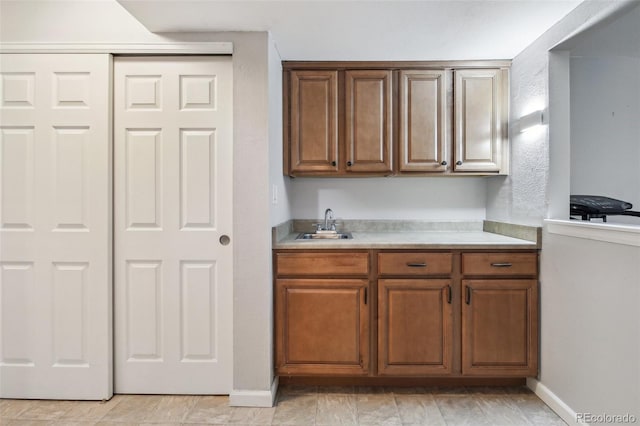 4231 W Ponds Cir, Littleton, CO 80123 - kitchen with light countertops and brown cabinetry