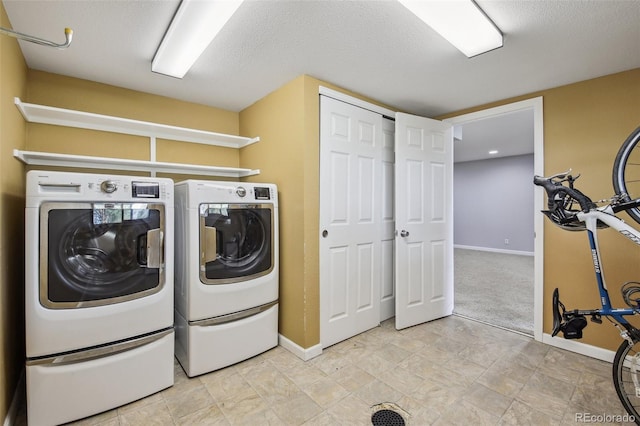4231 W Ponds Cir, Littleton, CO 80123 - washroom featuring washer and dryer and a textured ceiling