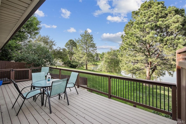 4231 W Ponds Cir, Littleton, CO 80123 - wooden deck with a yard and outdoor dining space