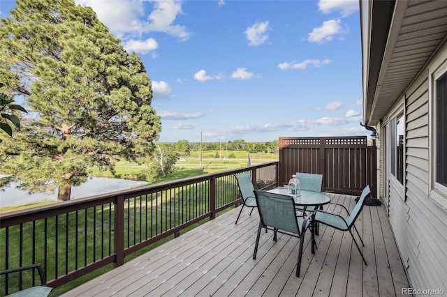 4231 W Ponds Cir, Littleton, CO 80123 - deck with outdoor dining space and a yard
