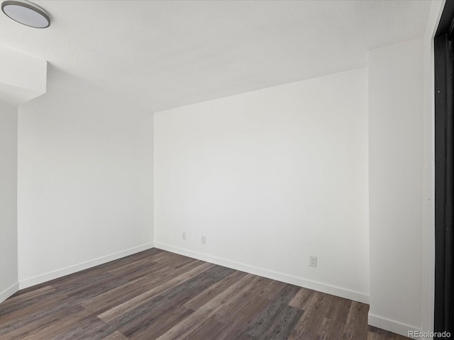 empty room featuring dark hardwood / wood-style floors