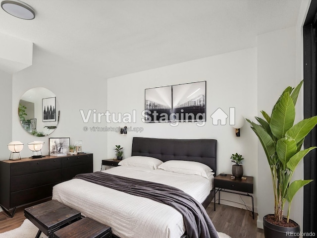 bedroom featuring wood-type flooring