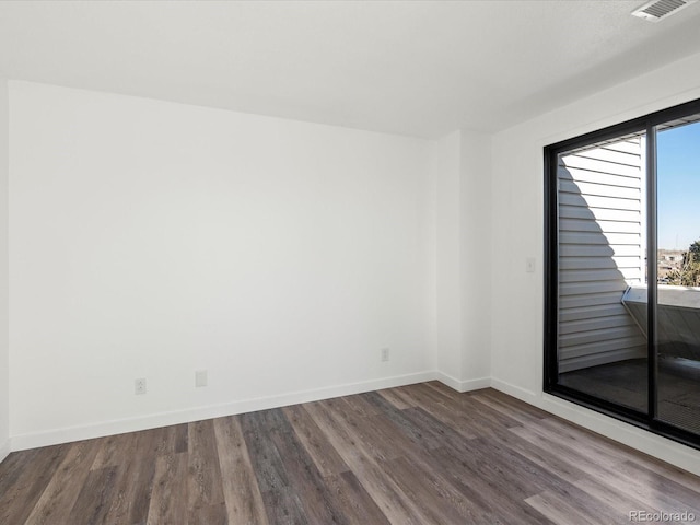 unfurnished room featuring hardwood / wood-style floors