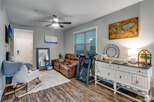 interior space with ceiling fan and wood finished floors