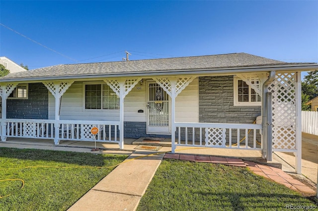 5041 W Nevada Pl, Denver, CO 80219 - ranch-style home with covered porch, stone siding, and roof with shingles