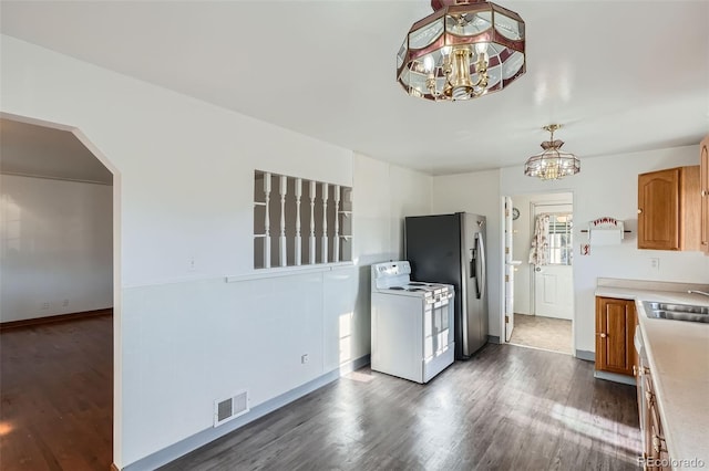 5041 W Nevada Pl, Denver, CO 80219 - kitchen with a chandelier, white electric range, dark wood finished floors, and light countertops