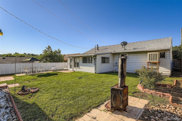 5041 W Nevada Pl, Denver, CO 80219 - back of house with a patio and roof with shingles