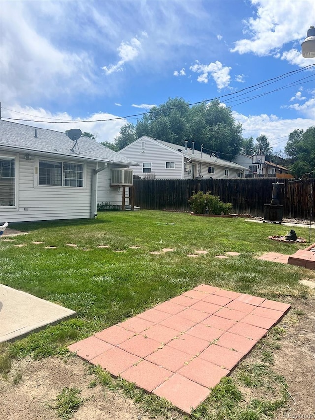 5041 W Nevada Pl, Denver, CO 80219 - view of yard with a patio and a wall mounted air conditioner