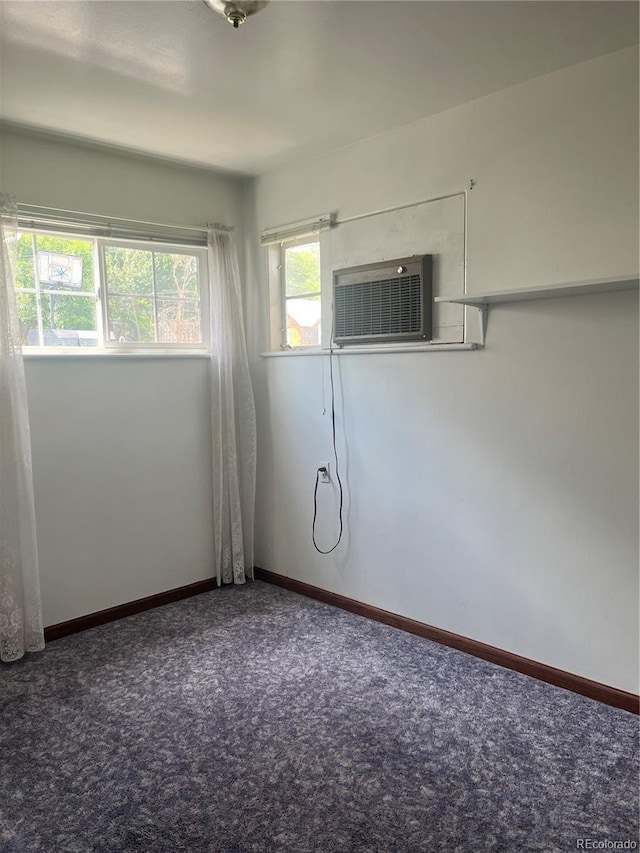 5041 W Nevada Pl, Denver, CO 80219 - empty room featuring carpet floors and a wall unit AC