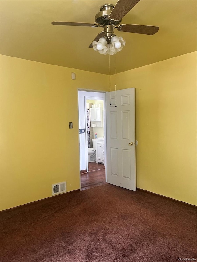 5041 W Nevada Pl, Denver, CO 80219 - empty room with dark colored carpet and a ceiling fan