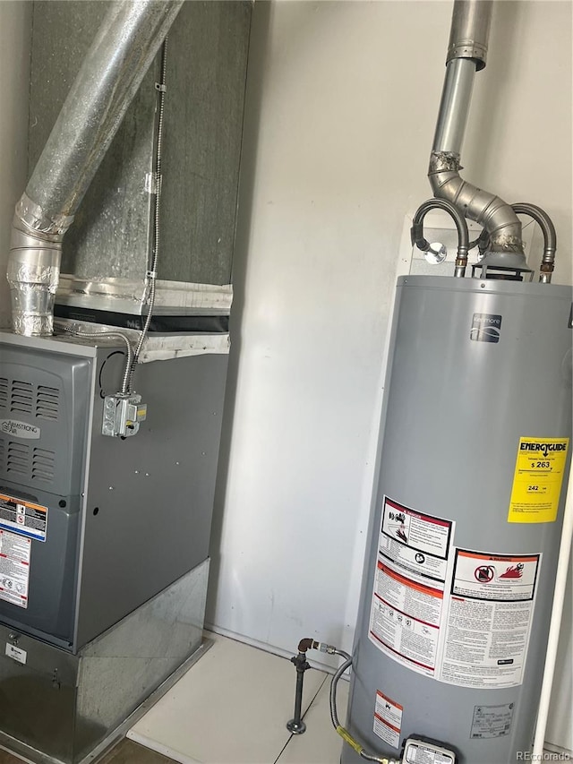 5041 W Nevada Pl, Denver, CO 80219 - utility room featuring water heater and heating unit
