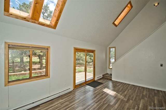 interior space with dark hardwood / wood-style flooring, a skylight, high vaulted ceiling, and a baseboard radiator