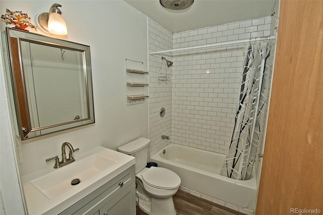 full bathroom featuring vanity, shower / bathtub combination with curtain, wood-type flooring, and toilet