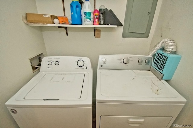 clothes washing area with electric panel and washer and clothes dryer