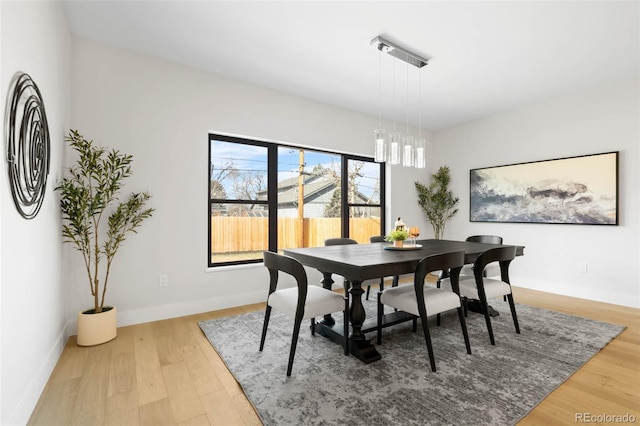 dining room with wood finished floors and baseboards