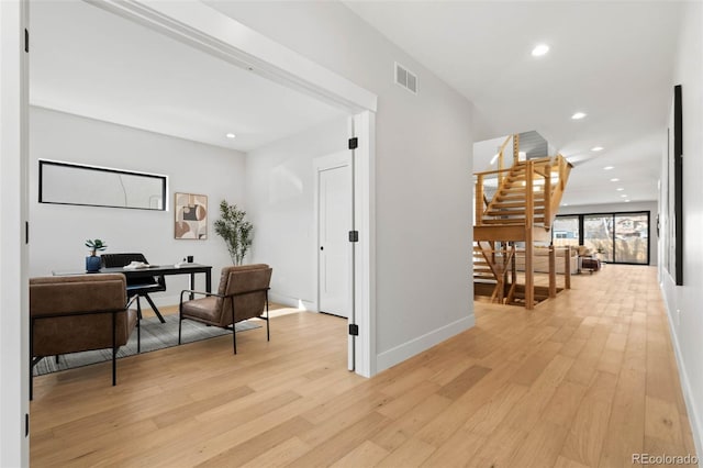 hallway featuring visible vents, light wood-style flooring, recessed lighting, stairway, and baseboards