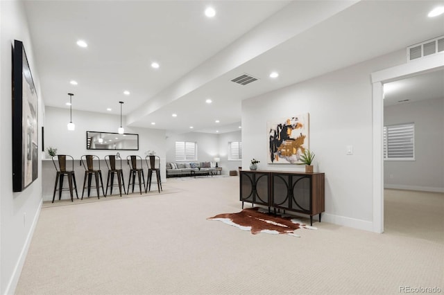 interior space featuring recessed lighting, carpet floors, visible vents, and baseboards
