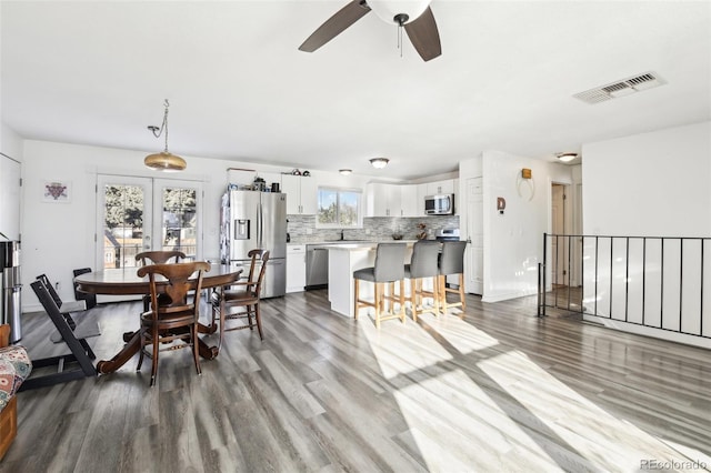 dining room featuring sink and hardwood / wood-style floors