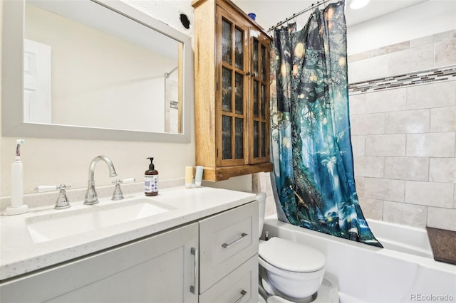 full bathroom with vanity, toilet, and shower / tub combo