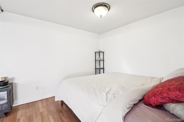 bedroom featuring hardwood / wood-style floors