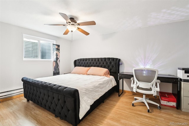 bedroom with baseboard heating, a textured ceiling, ceiling fan, and light hardwood / wood-style flooring