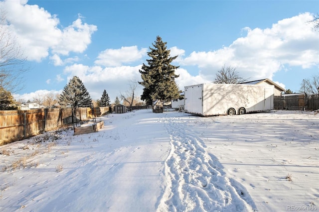 view of yard layered in snow