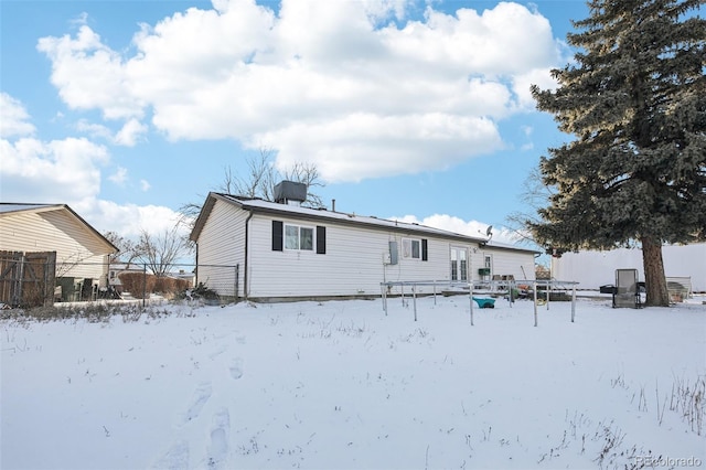 view of snow covered house