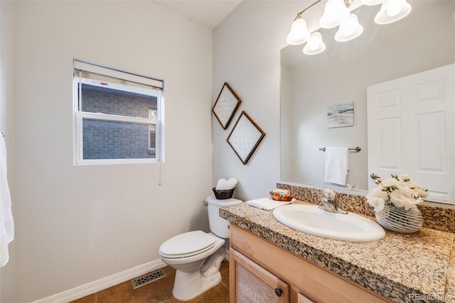 bathroom with visible vents, baseboards, toilet, tile patterned flooring, and vanity