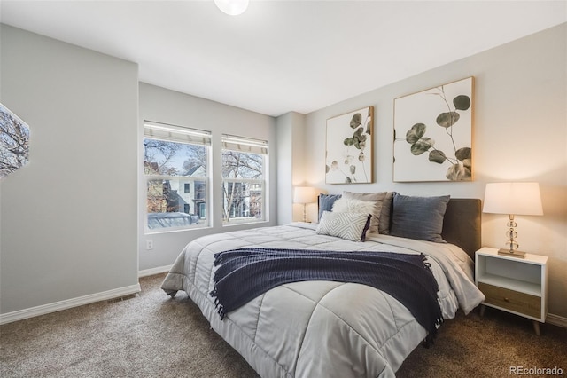 carpeted bedroom featuring baseboards