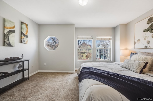 carpeted bedroom with baseboards