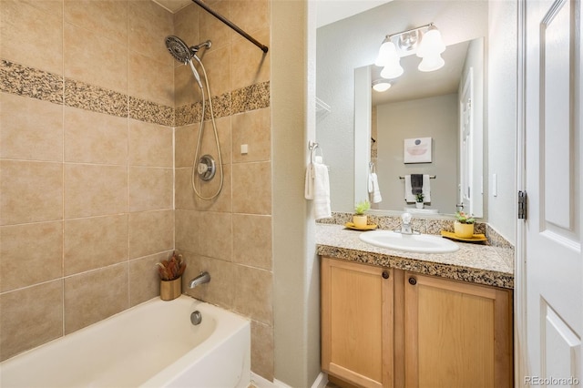 bathroom featuring shower / washtub combination and vanity