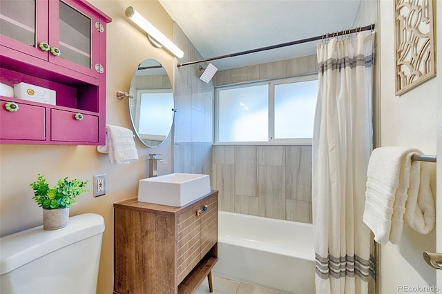 bathroom with vanity, tile patterned floors, toilet, and shower / bathtub combination with curtain