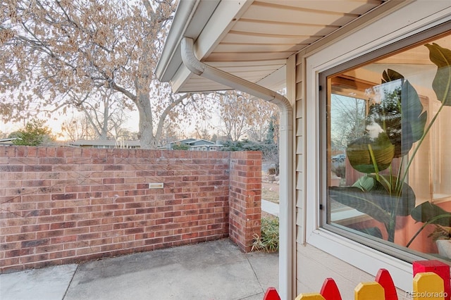 view of patio featuring fence