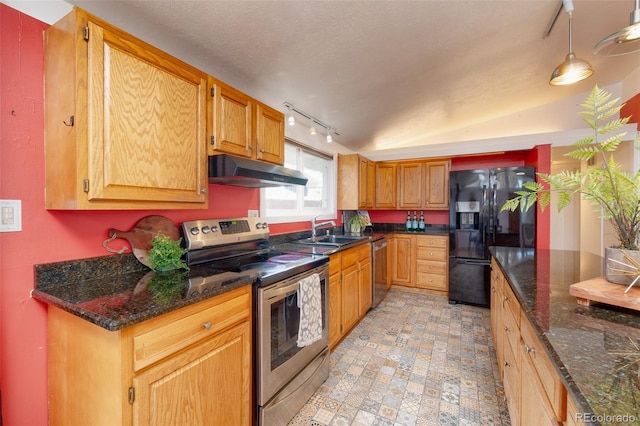 2370 S Meade St, Denver, CO 80219 - kitchen featuring appliances with stainless steel finishes, under cabinet range hood, a sink, rail lighting, and dark stone counters