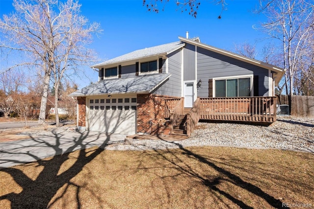 view of front of property featuring brick siding, fence, concrete driveway, roof with shingles, and a garage