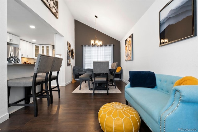 living room featuring baseboards, dark wood-type flooring, an inviting chandelier, and vaulted ceiling