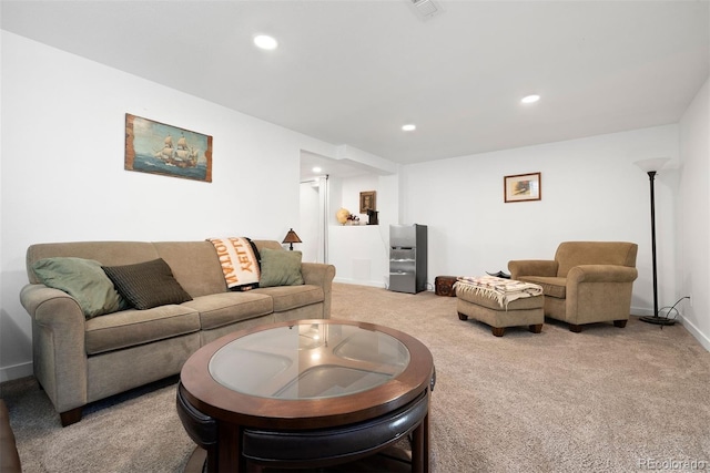 living room with visible vents, recessed lighting, baseboards, and carpet floors