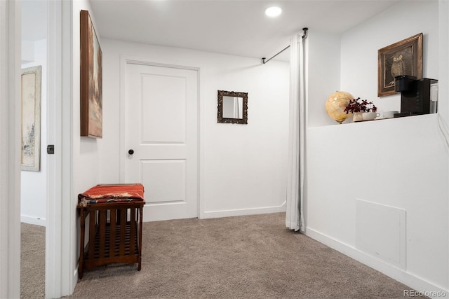 hallway featuring recessed lighting, baseboards, and carpet floors