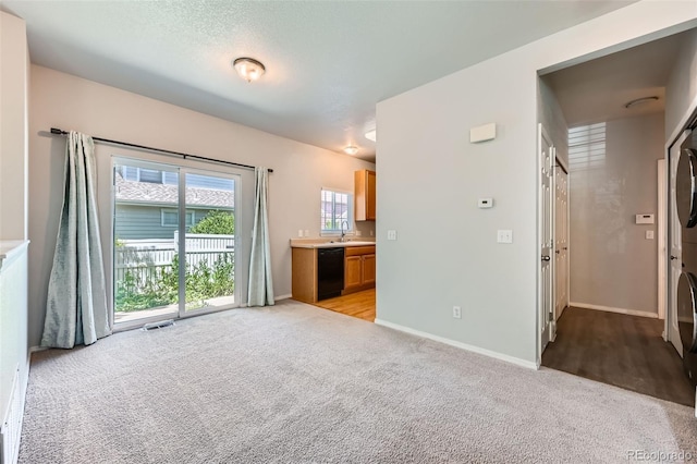 1389 S Quintero Way, Aurora, CO 80017 - unfurnished bedroom featuring access to exterior, light colored carpet, and ensuite bath