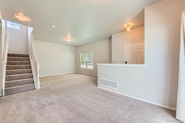1389 S Quintero Way, Aurora, CO 80017 - unfurnished living room with carpet flooring and stairs