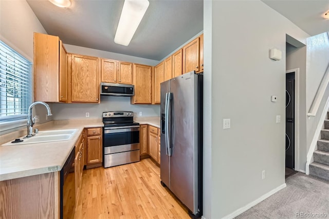 1389 S Quintero Way, Aurora, CO 80017 - kitchen with appliances with stainless steel finishes, light countertops, and light wood finished floors