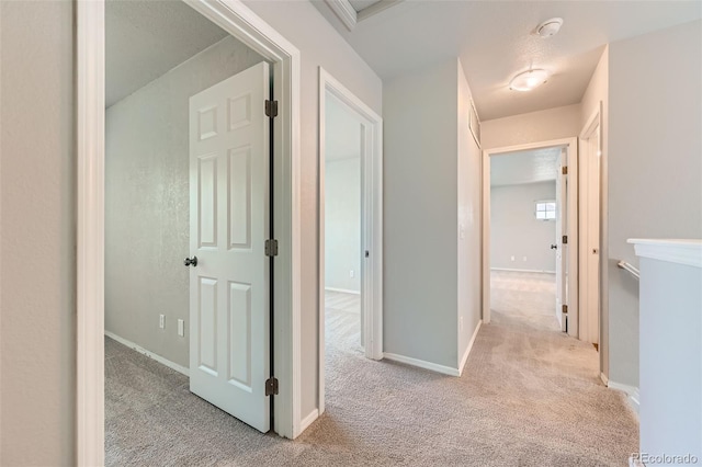 1389 S Quintero Way, Aurora, CO 80017 - hallway featuring light carpet and baseboards