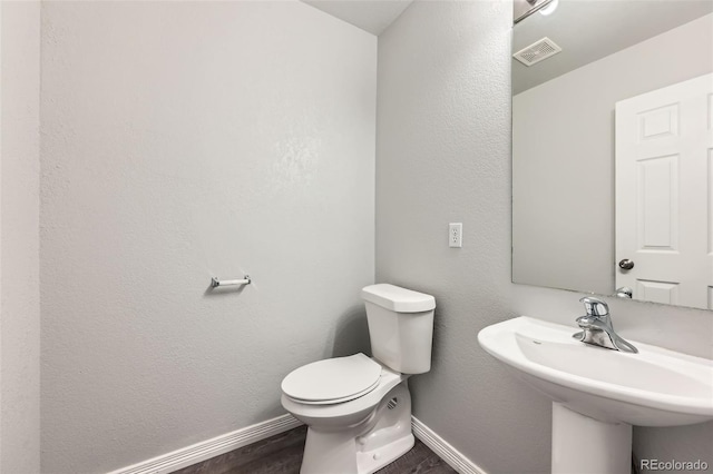 1389 S Quintero Way, Aurora, CO 80017 - bathroom featuring toilet and wood finished floors