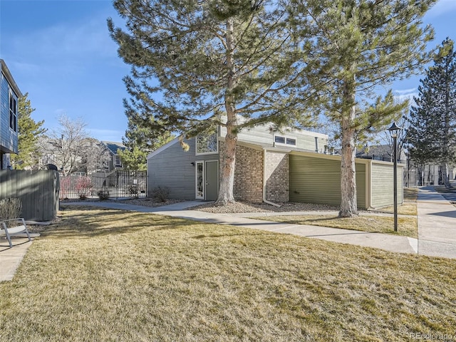 view of side of property featuring a lawn