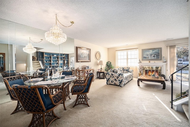 dining room featuring carpet floors, a textured ceiling, and a notable chandelier