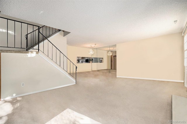 unfurnished living room featuring a textured ceiling