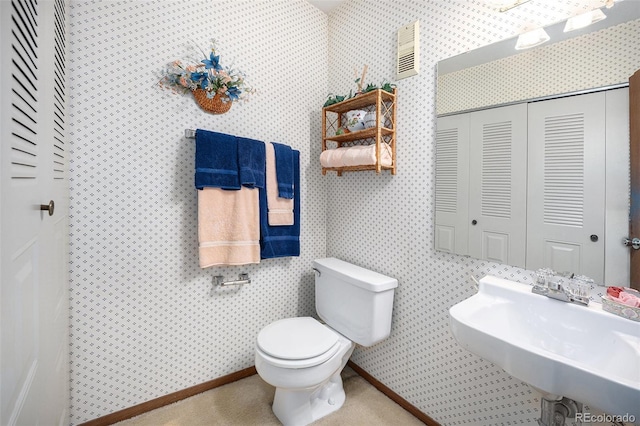 bathroom featuring sink and toilet