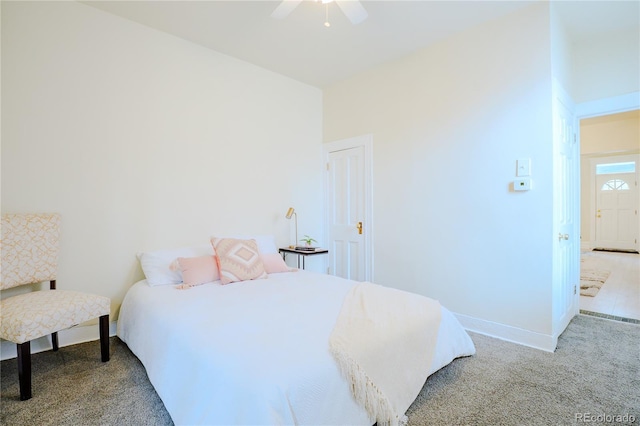 carpeted bedroom with baseboards and a ceiling fan