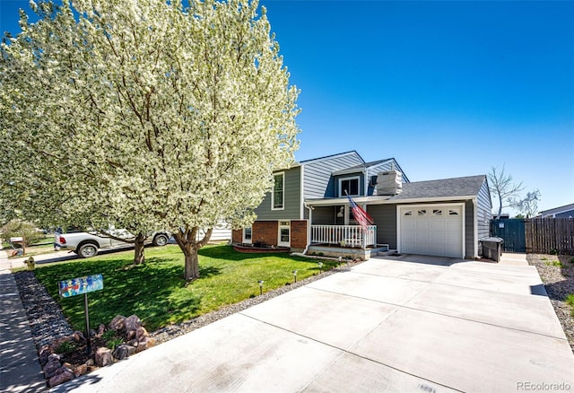 862 Centennial Way, Bennett, CO 80102 - view of front of property with brick siding, an attached garage, concrete driveway, and covered porch