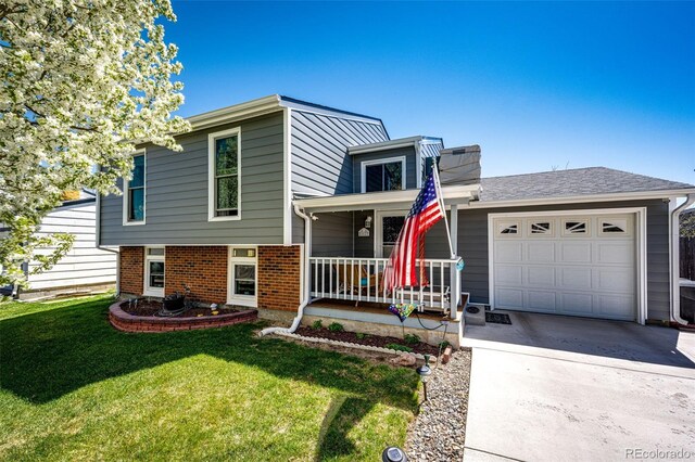 862 Centennial Way, Bennett, CO 80102 - tri-level home with a porch, concrete driveway, a front lawn, and a garage
